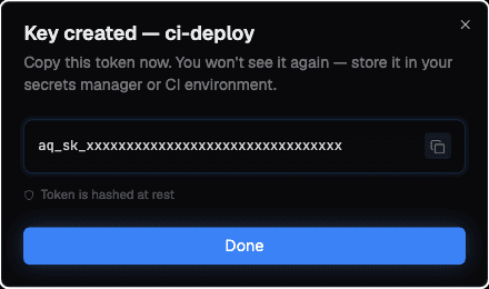 The created-key screen showing the token once, with a copy button